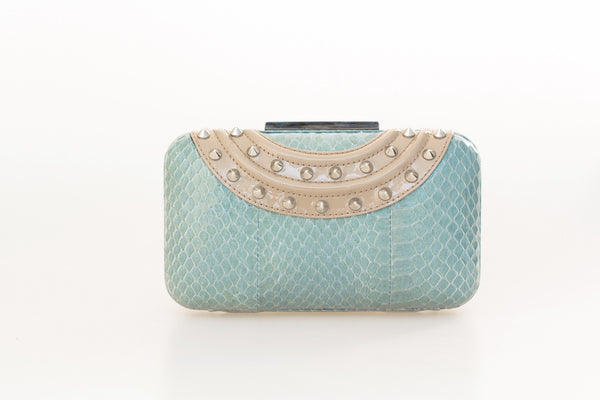 Aqua water snake skin clutch with nude patent leather trim, silver-tone pointed studs, and a sleek, compact mirror design.