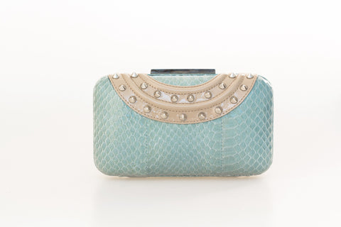 Aqua water snake skin clutch with nude patent leather trim, silver-tone pointed studs, and a sleek, compact mirror design.