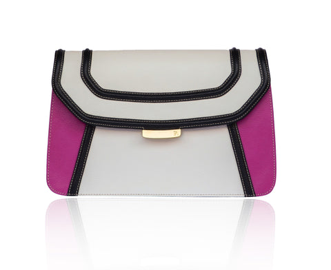 Color-blocked cream, black, and fuchsia textured leather clutch with gold-tone hardware and a chic designer logo plaque.