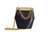 Black Valerie mini bucket bag in textured water snake leather with gold-tone hardware, designer clasp, and detachable chain.