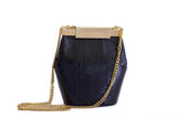 Black watersnake mini bucket bag featuring a gold-tone logo clasp and detachable chain strap for an elegant, luxe look.
