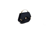 Black velvet Calypso top-handle bag featuring elegant gold-tone hardware and a structured 23cm silhouette.