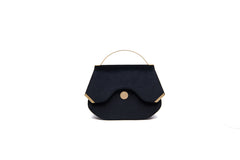 Black velvet Calypso top-handle bag with gold-tone hardware and designer logo, 23cm wide, elegant structured design.