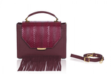 Bordeaux Steffany top handle bag in textured calf leather with water snake flap, suede fringe, and gold hardware.