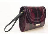 Cherry red and black python skin clutch with gold-tone hardware, detachable leather wrist strap, and elegant 18cm compact design.