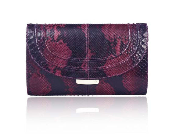 Cherry red and black python skin clutch featuring gold-tone hardware and an engraved designer plaque on the front lock.