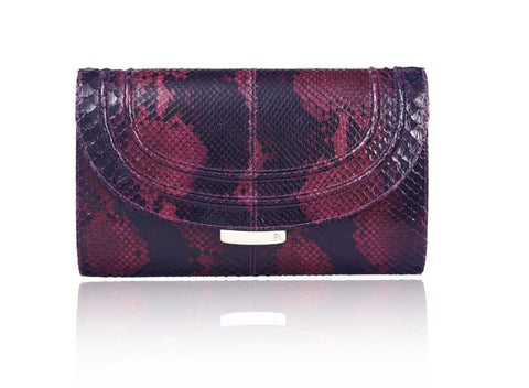 Cherry red and black python skin clutch featuring gold-tone hardware and an engraved designer plaque on the front lock.