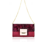 Cherry red lamb leather clutch with python flap, powder pink pocket, and gold chain strap.