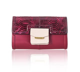 Cherry red lamb leather Serena clutch with python flap, powder pink pocket, and elegant gold-tone logo hardware.