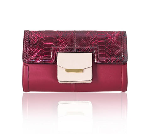 Cherry red lamb leather Serena clutch with python flap, powder pink pocket, and elegant gold-tone logo hardware.