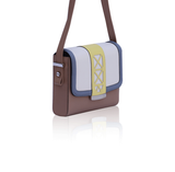 Chic Anya calf leather crossbody bag in cream, beige, and blue with a yellow laser-cut trim and silver-tone hardware.