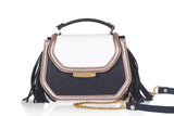 Cream and black calf leather mini bag with gold-tone hardware, side tassels, and a detachable chain strap.