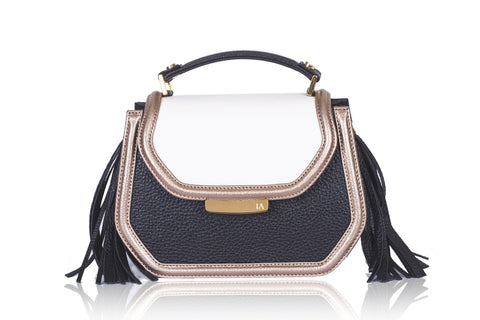 Cream and black calf leather mini Anabella bag with gold-tone hardware, side tassels, and a chic structured design.