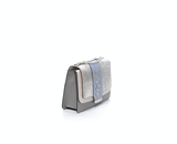 Cream and grey textured leather Jackie O shoulder bag with a silver python flap, blue laser-cut detail, and chain strap.