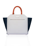 Cream and navy textured leather Sharon trapeze tote with papaya handles and silver hardware.