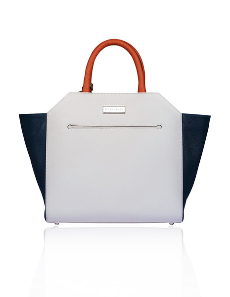 Cream and navy textured leather Sharon trapeze tote with papaya handles and silver hardware.