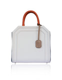 Cream and navy textured leather Sharon trapeze tote with papaya handles and a nude hanging tag.