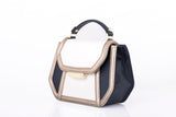 Mini Anabella tote in cream and navy calf leather with metallic trim, gold-tone logo plaque, and structured top handle.