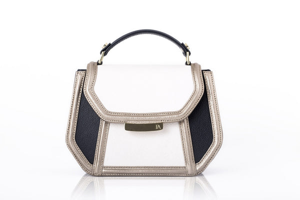 Mini Anabella tote in cream and navy calf leather with a metallic finish, gold-tone logo plaque, and structured top handle.