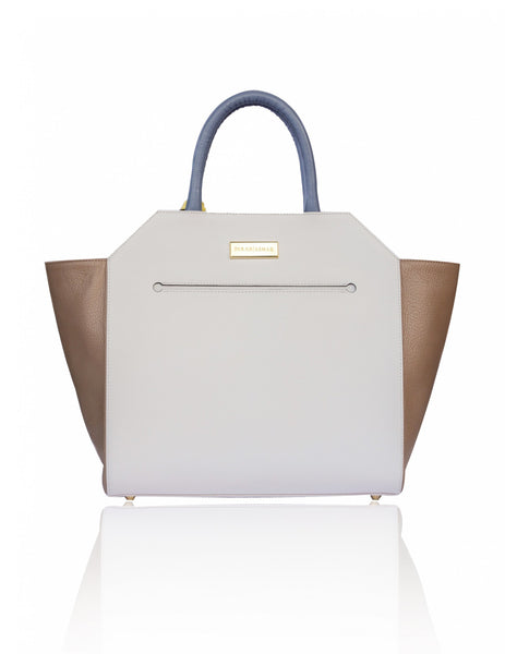 Structured cream and sand textured leather Sharon tote with teal blue handles, gold hardware, and a designer logo plaque.