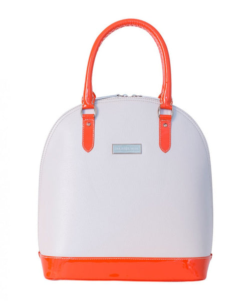 Structured cream calf leather tote with neon orange patent accents, silver hardware, and a sophisticated dome silhouette.