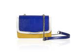 Mini Jackie O shoulder bag in mustard calf leather, electric blue lizard flap, and cream accents with a silver chain strap.