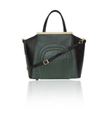 Emerald green and black smooth leather trapeze tote with front zip, gold designer plaque, and detachable shoulder strap.