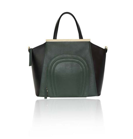 Emerald green and black smooth leather trapeze tote with a front zip pocket and elegant gold designer plaque.