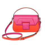 Fuchsia and blood orange Napa leather Mira shoulder bag with silver hardware, two-tone strap, and designer logo detail.