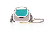 Mini Anabella tote in green nubuck and greige calf leather with side tassels, gold logo plaque, and detachable chain strap.