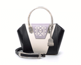 Ashley tote in black and cream textured leather with a lilac laser-cut front, python-effect handle, and silver logo plaque.