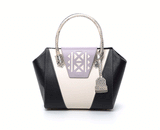 Ashley tote in black and cream textured leather with a lilac laser-cut front, python-effect handle, and silver logo.