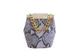 Natural beige python skin mini bucket bag featuring a gold-tone designer logo clasp and a chunky gold chain handle.