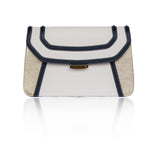Navy and cream textured leather clutch with gold accents, magnetic clasp, and elegant designer plaque.