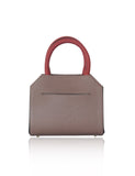 Mini Sharon tote in nude and black textured calf leather with vibrant orange handles and elegant gold-tone hardware.