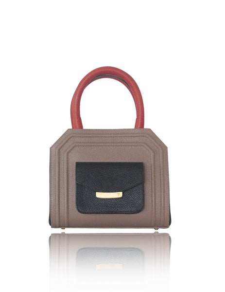 Mini Sharon tote in nude, black, and orange textured calf leather with gold-tone hardware and a chic front pocket.