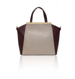 Structured nude and burgundy textured leather tote bag featuring a gold-plated plaque and elegant top handles.