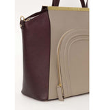 Oversized nude and burgundy textured leather tote with gold hardware, front zip pocket, and structured top handle design.