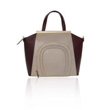Oversized nude and burgundy textured leather Sharon tote with gold-plated plaque, top handles, and front pocket detail.