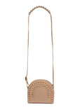 Nude textured leather Thalia cross bag featuring gold-tone pointed studs and an adjustable strap for a chic, minimalist look.