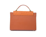 Papaya orange medium tote in textured ostrich leather with gold-tone hardware and a sleek, formal design.