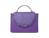 Plum Steffany tote in textured ostrich skin with a designer logo plaque, silver-tone hardware, and a structured handle.