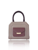 Mini Sharon tote in powder pink and rose smooth leather with bordeaux handles, gold-tone hardware, and front pocket.