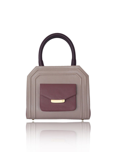 Mini Sharon tote in powder pink and rose smooth leather with bordeaux handles, gold-tone hardware, and front pocket.