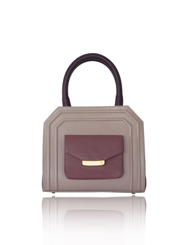 Mini Sharon tote in powder pink and rose smooth leather with bordeaux handles, gold-tone hardware, and front pocket.