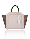Powder pink and taupe textured leather Sharon trapeze tote with black handles and a cream hanging tag.