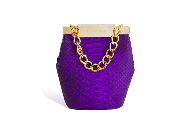 Electric purple python mini bucket bag with gold-tone hardware, designer logo clasp, and a detachable chain strap.