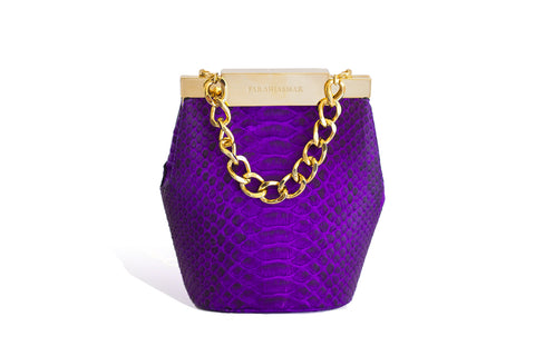 Electric purple python mini bucket bag with gold-tone hardware, designer logo clasp, and a detachable chain strap.