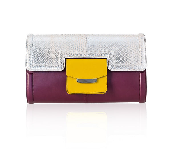 Serena clutch in plum lamb leather with a silver beige python flap, mustard pocket, and silver-tone designer logo plaque.