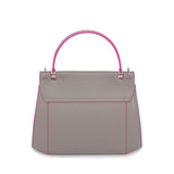 Stone Gray smooth Napa leather Nora top handle bag featuring vibrant fuchsia edge paint and polished silver-tone hardware.